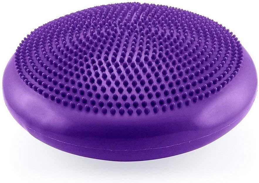 Purple silicone scrubber with textured surface on a white background